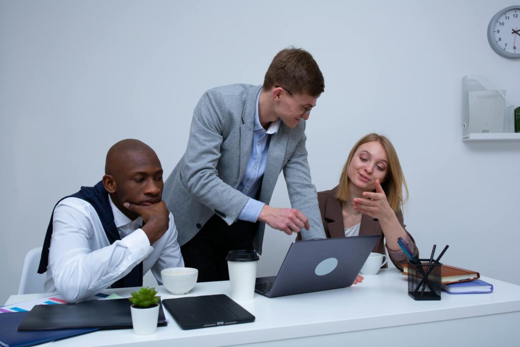 Team collaborating in a modern workspace using AI-powered productivity tools