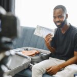 Male YouTuber recording trending video content in a home studio setup